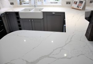 Calacatta Quartz Worktops with matching Breakfast bar and window Cill.